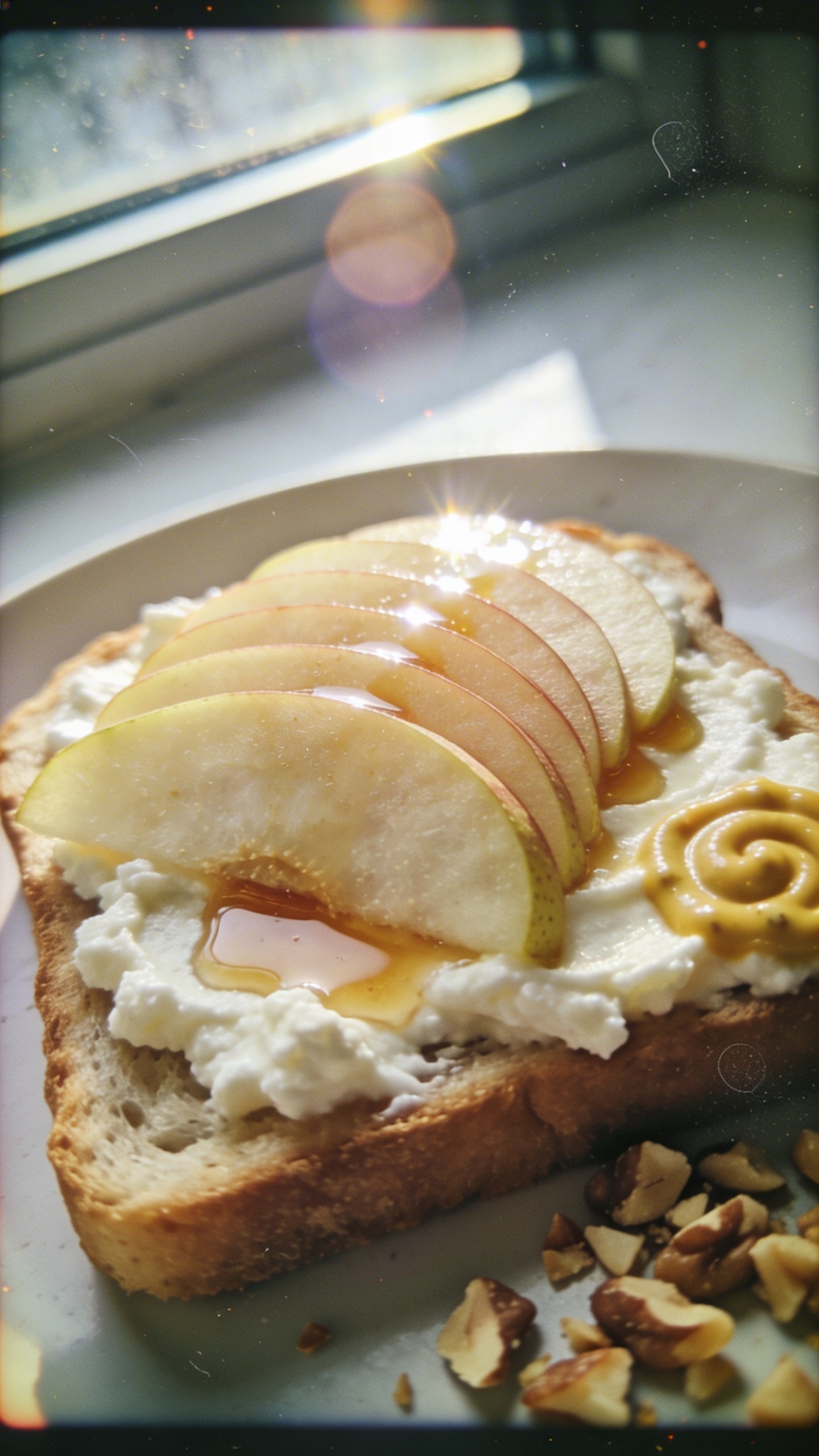A real-feel breakfast scene featuring cottage cheese toast topped with honey-money mustard pear delight: toast slices spread with creamy cottage cheese, thin pear slices fanned elegant on top, a light drizzle of honey or maple, and a subtle swirl of Dijon mustard visible on one corner. Nuts chopped and sprinkled for crunch, suggesting a brunch plate. Shoot as if captured quickly by an iPhone: natural window light streaming in, casual, imperfect composition with a slightly tilted horizon. Include realistic phone-camera quirks: tiny lens flare from the window, slight overexposed highlights on the pear and honey, minor motion blur if a hand moved, grain that varies with light, fingerprint marks on the lens edge, and a slight vignette from casual exposure. The scene should feel un-staged, no text, no signs of AI post-processing; “screenshot quality” realism with compressed 1080p feel. Subtle, light post-processing hint: minimal color shift and a small amount of sharpening, as if scaled down and up again. No words on image.