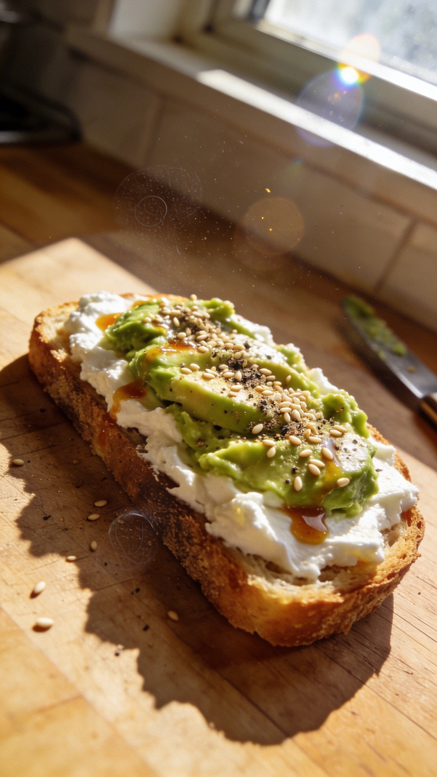 A real, authentic photo of Cottage Cheese Avocado Power Toasts as the main subject, shot with an iPhone in natural window light. Casual, imperfect composition: a wooden kitchen counter or rustic table, a single sturdy slice of toasted bread topped thickly with white cottage cheese, mashed avocado layered on top, and a sprinkle of sesame seeds, cracked pepper, and a few sesame seeds catching a bit of light. Include light drizzle of hot sauce or lemon juice for a bright touch. Slightly imperfect details to convey realism: small overexposed highlights on the shine of avocado, a tiny lens flare from the window, a faint motion blur on a nearby utensil, a touch of grain in the shadows, and a subtly tilted horizon. No staging, no visible captions or text, no heavy editing; shot quickly, finger on the lens occasionally for a natural sense of immediacy, maintaining a “screenshot quality” vibe and a compressed, 1080p feel. Optional micro imperfections: a tiny fingerprint on the lens and a hint of post-processing that keeps the image looking like real, everyday phone photography.